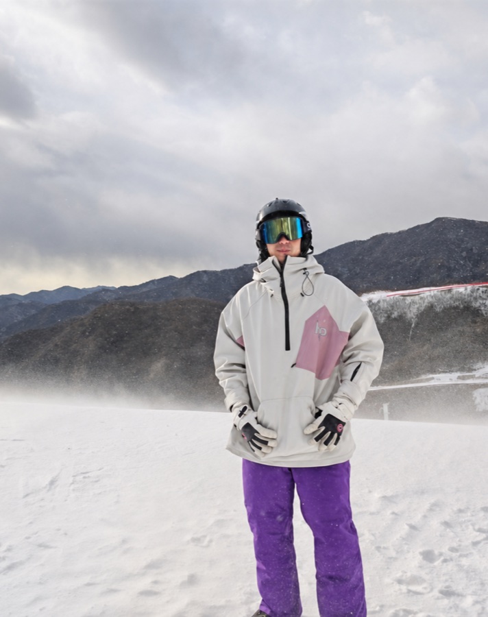 Herbert Yan standing on a snowy mountain slope